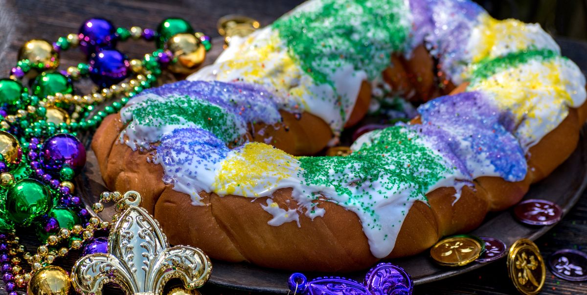 Decorated King Cake with mardi gras beads